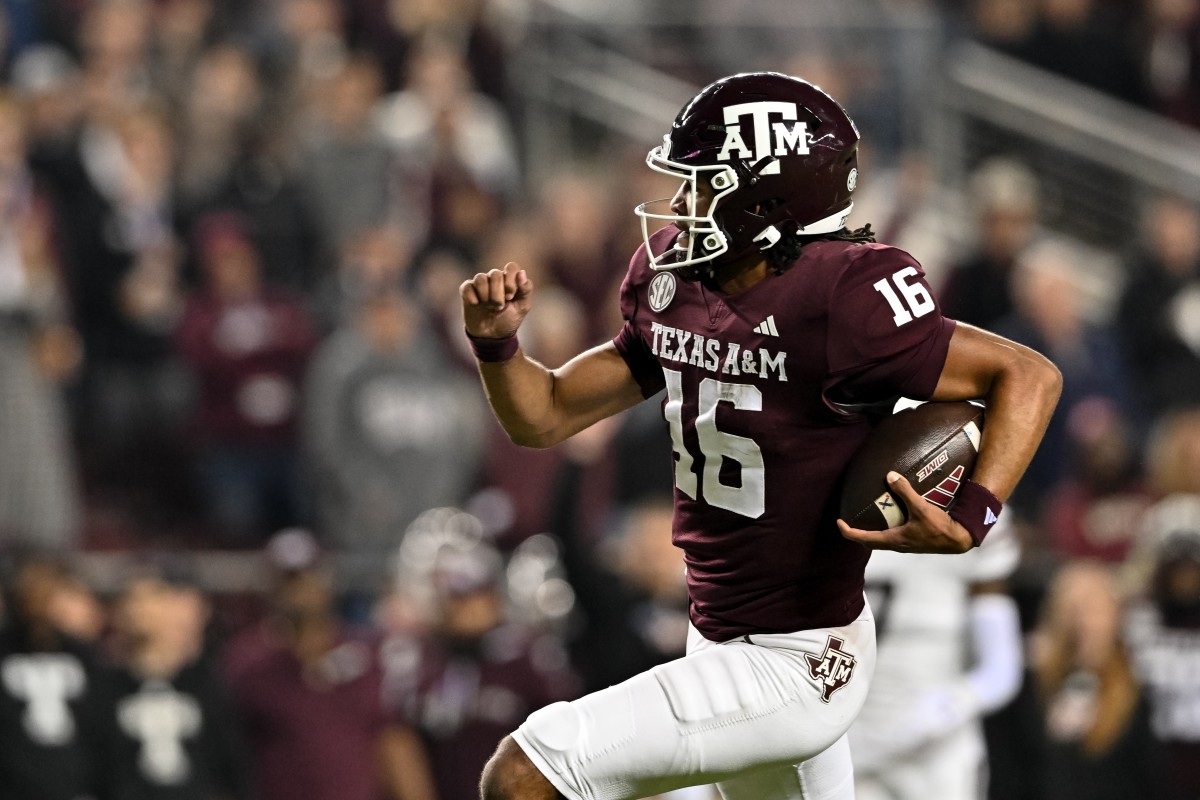 Nov 11, 2023; College Station, Texas, USA; Texas A&M Aggies quarterback Jaylen Henderson (16) runs the ball into the end zone for a touchdown during the first quarter against the Mississippi State Bulldogs at Kyle Field.